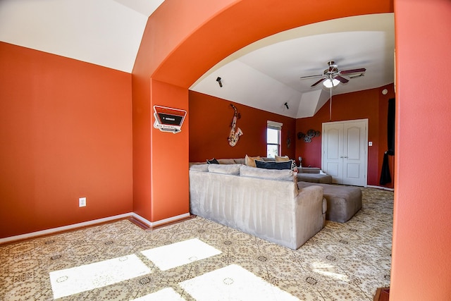 19707 Mission Pines Ln, Richmond, TX 77407 - living area featuring lofted ceiling, a ceiling fan, arched walkways, and baseboards