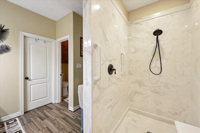 4810 Majestic Dr, Baytown, TX 77523 - bathroom featuring a marble finish shower and wood finished floors