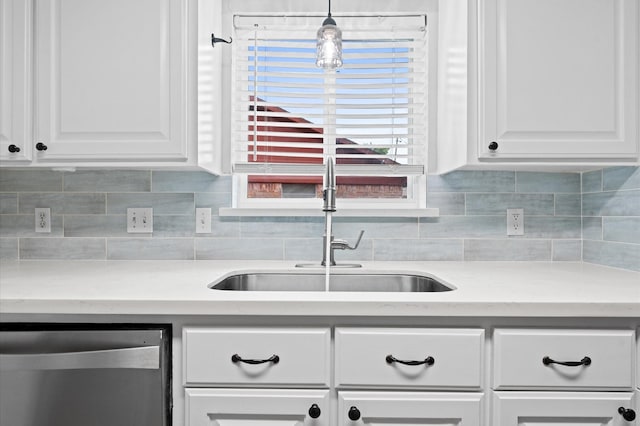 9407 Brooding Oak Cir, Houston, TX 77096 - kitchen with stainless steel dishwasher, a sink, decorative backsplash, and white cabinetry