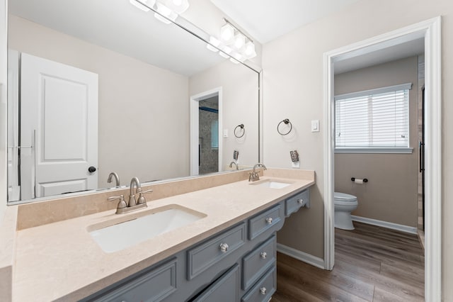 9407 Brooding Oak Cir, Houston, TX 77096 - full bathroom featuring wood finished floors and double vanity