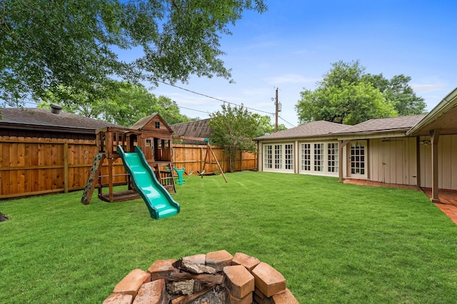 9407 Brooding Oak Cir, Houston, TX 77096 - view of yard with french doors and a playground