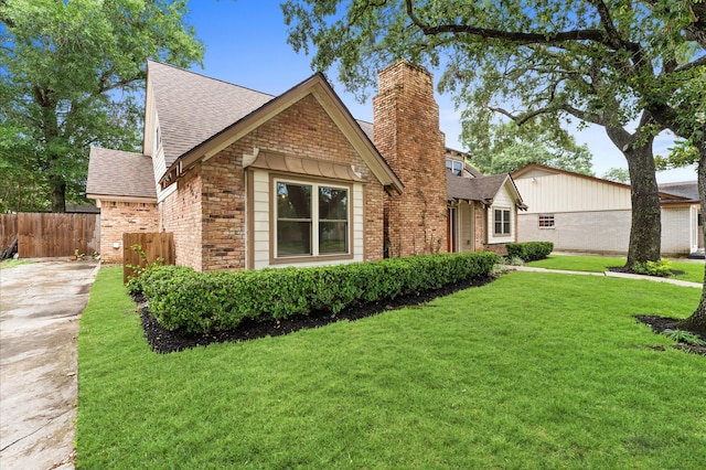 9407 Brooding Oak Cir, Houston, TX 77096 - view of front of home featuring roof with shingles, a chimney, brick siding, and concrete driveway