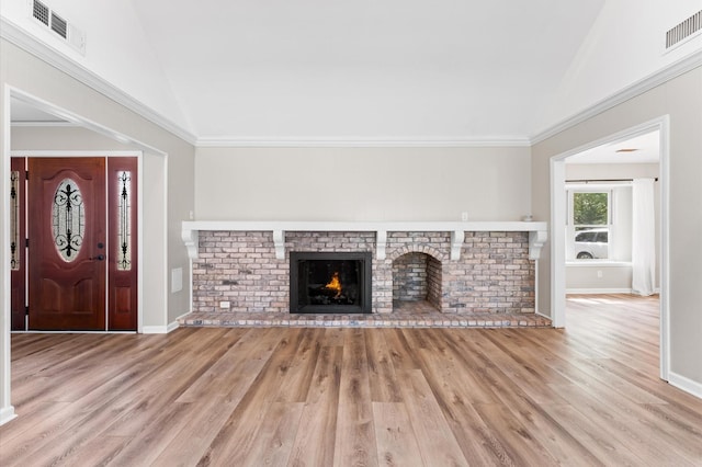 9407 Brooding Oak Cir, Houston, TX 77096 - unfurnished living room featuring vaulted ceiling, wood finished floors, a fireplace, and baseboards