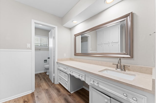 9407 Brooding Oak Cir, Houston, TX 77096 - bathroom with vanity, toilet, and wood finished floors