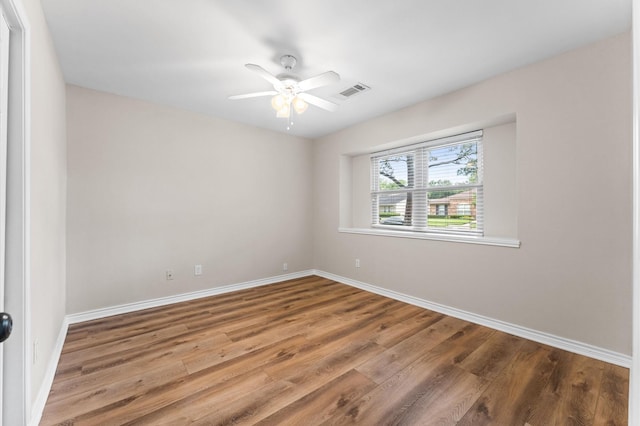 9407 Brooding Oak Cir, Houston, TX 77096 - unfurnished room featuring wood finished floors, baseboards, and ceiling fan