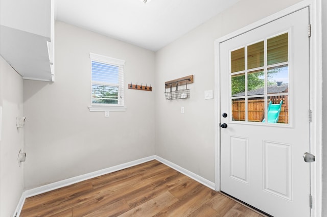 9407 Brooding Oak Cir, Houston, TX 77096 - doorway to outside with wood finished floors and baseboards
