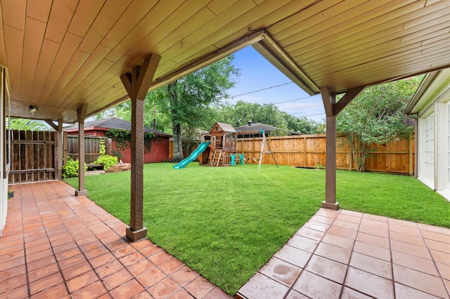 9407 Brooding Oak Cir, Houston, TX 77096 - view of yard featuring a patio area and a playground