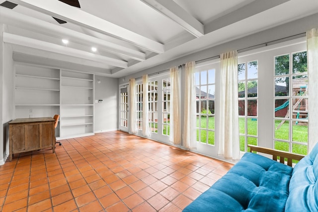 9407 Brooding Oak Cir, Houston, TX 77096 - living area with beam ceiling, tile patterned floors, built in shelves, and a ceiling fan