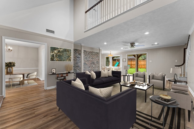 9407 Brooding Oak Cir, Houston, TX 77096 - living room featuring wood finished floors, ornamental molding, ceiling fan, and recessed lighting