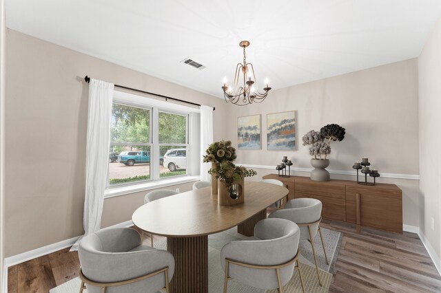 9407 Brooding Oak Cir, Houston, TX 77096 - dining room with a chandelier and wood finished floors