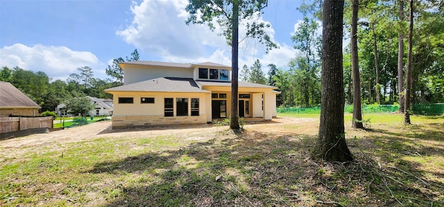1020 Prescott Dr, Conroe, TX 77301 - rear view of property featuring stucco siding