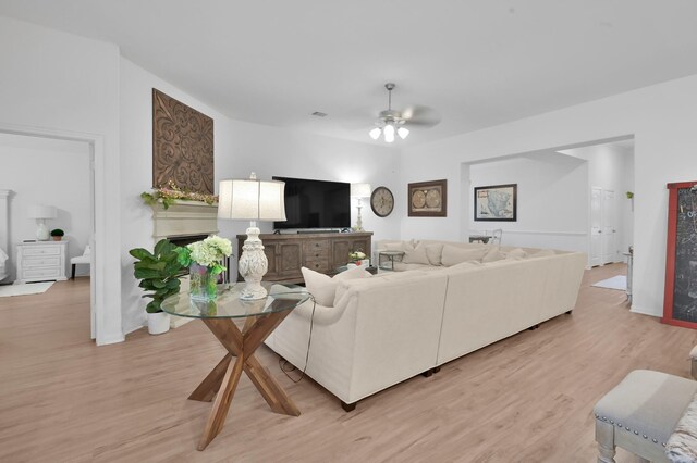 16220 Fayette St, Conroe, TX 77303 - living area with light wood-style floors and ceiling fan