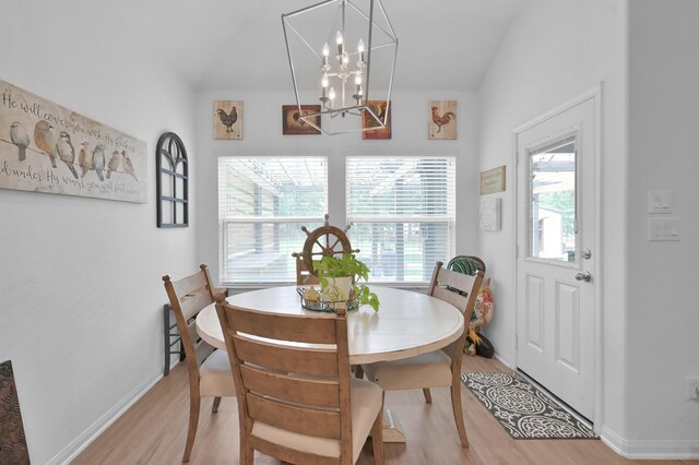 16220 Fayette St, Conroe, TX 77303 - dining room featuring light wood finished floors, a chandelier, and baseboards