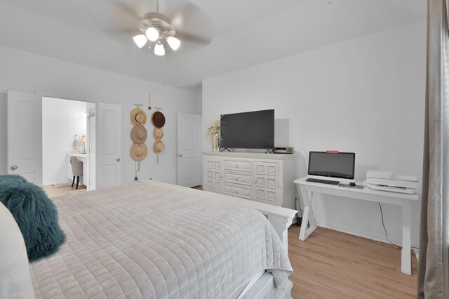 16220 Fayette St, Conroe, TX 77303 - bedroom with light wood finished floors and ceiling fan
