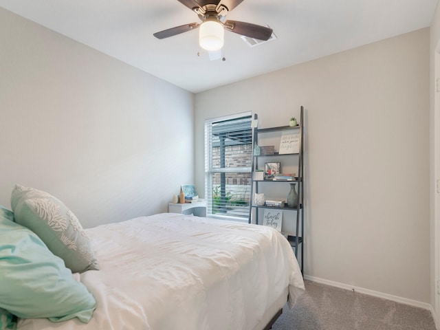 14942 Dane Ct, Conroe, TX 77316 - bedroom with carpet flooring, baseboards, and ceiling fan