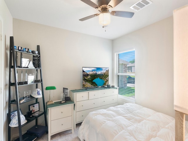 14942 Dane Ct, Conroe, TX 77316 - bedroom featuring light carpet and a ceiling fan