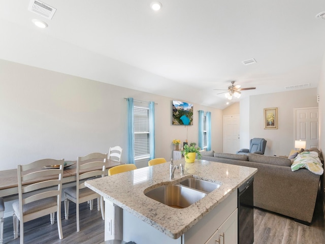 14942 Dane Ct, Conroe, TX 77316 - kitchen with a sink, wood finished floors, dishwasher, open floor plan, and a ceiling fan