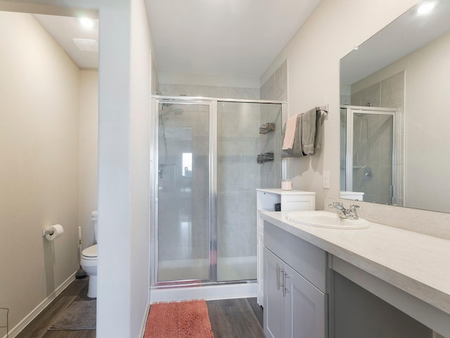14942 Dane Ct, Conroe, TX 77316 - full bath featuring toilet, wood finished floors, a stall shower, and vanity