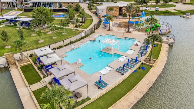 4138 Watson Dr, Rosharon, TX 77583 - view of swimming pool with a water view