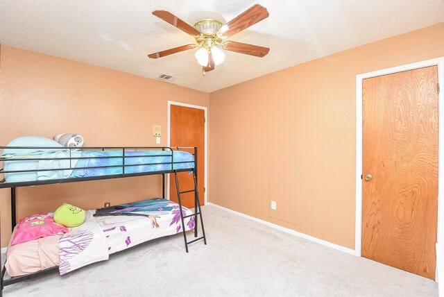 3310 Park Haven Ln, Deer Park, TX 77536 - bedroom featuring carpet flooring, ceiling fan, and a textured ceiling