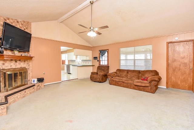 3310 Park Haven Ln, Deer Park, TX 77536 - living room with beamed ceiling, ceiling fan, carpet, a fireplace, and high vaulted ceiling