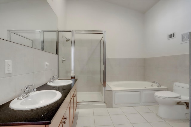 1601 W Webster St Unit 9, Houston, TX 77019 - full bath featuring a shower stall, a garden tub, tile patterned floors, double vanity, and toilet