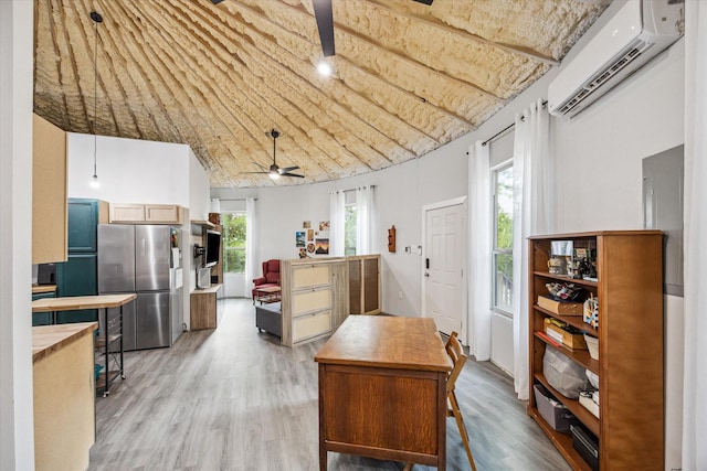 8354 Hannay Rd, Pattison, TX 77423 - kitchen featuring freestanding refrigerator, a wall mounted air conditioner, butcher block countertops, ceiling fan, and light wood-style flooring