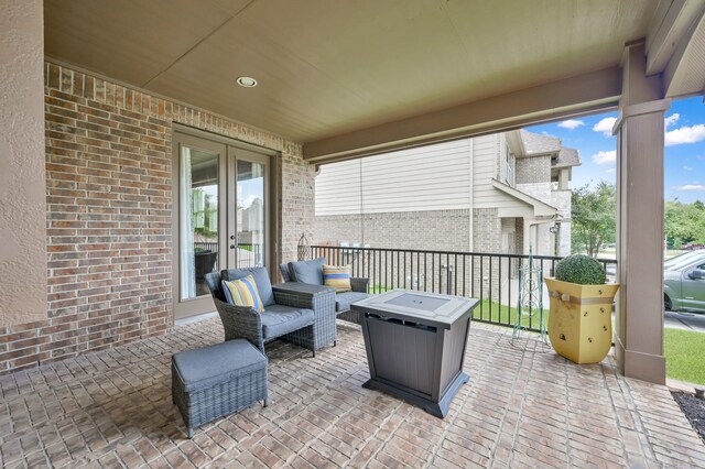 116 Owen Ridge Dr, Conroe, TX 77384 - view of patio featuring french doors and an outdoor fire pit