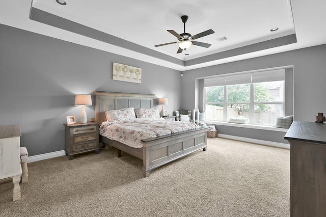 116 Owen Ridge Dr, Conroe, TX 77384 - carpeted bedroom with a raised ceiling, baseboards, and a ceiling fan