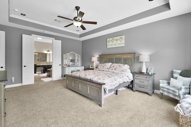 116 Owen Ridge Dr, Conroe, TX 77384 - bedroom featuring a tray ceiling, light colored carpet, baseboards, ensuite bathroom, and ornamental molding