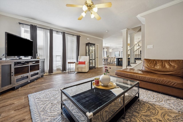 1310 Cohn St, Houston, TX 77007 - living area with a ceiling fan, wood finished floors, ornate columns, and crown molding