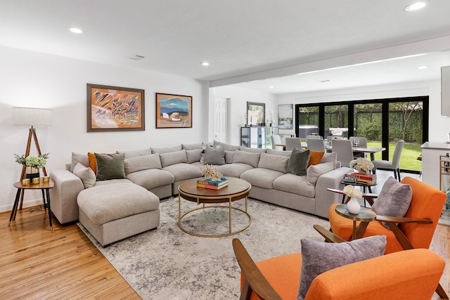 3923 W Main St, Houston, TX 77027 - living room with light wood-type flooring and recessed lighting