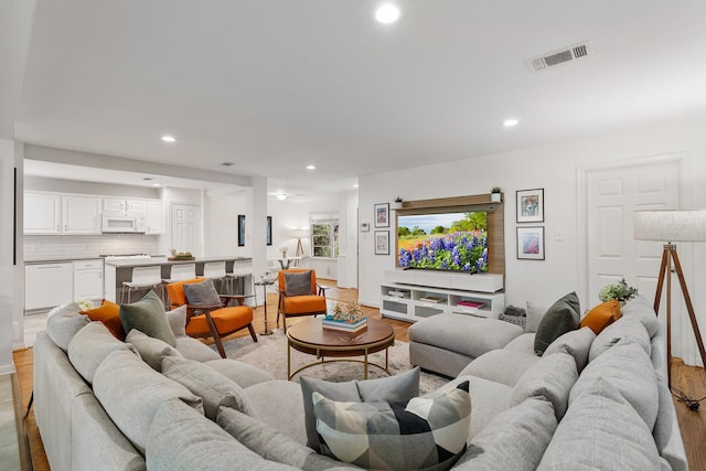3923 W Main St, Houston, TX 77027 - living area featuring light wood finished floors and recessed lighting