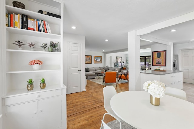 3923 W Main St, Houston, TX 77027 - dining area featuring light wood-style floors, recessed lighting, and built in features