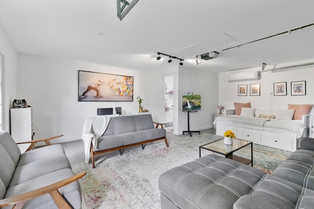 3923 W Main St, Houston, TX 77027 - living room with attic access, a wall unit AC, track lighting, a garage, and baseboards
