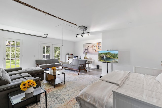 3923 W Main St, Houston, TX 77027 - bedroom with access to outside, track lighting, and concrete floors