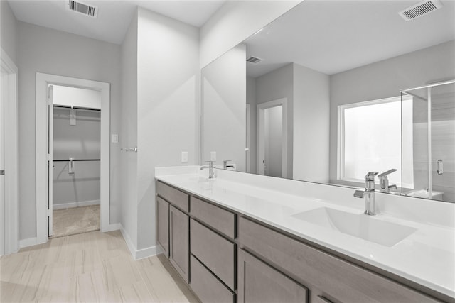 2547 Forest Cedar Ln, Conroe, TX 77301 - full bath featuring a stall shower, double vanity, and a spacious closet