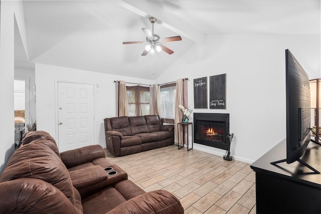 13031 Crystal Cove Dr, Houston, TX 77044 - living area featuring a warm lit fireplace, ceiling fan, beamed ceiling, light wood finished floors, and high vaulted ceiling