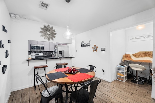 13031 Crystal Cove Dr, Houston, TX 77044 - dining room featuring light wood finished floors and baseboards