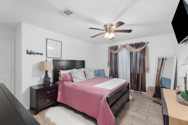 13031 Crystal Cove Dr, Houston, TX 77044 - bedroom with light wood-style flooring and ceiling fan