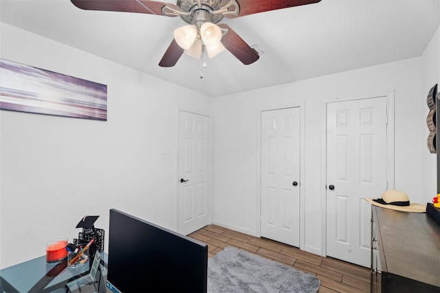 13031 Crystal Cove Dr, Houston, TX 77044 - office area with wood tiled floors and a ceiling fan