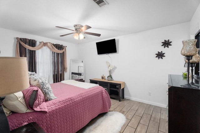 13031 Crystal Cove Dr, Houston, TX 77044 - bedroom featuring light wood finished floors and ceiling fan