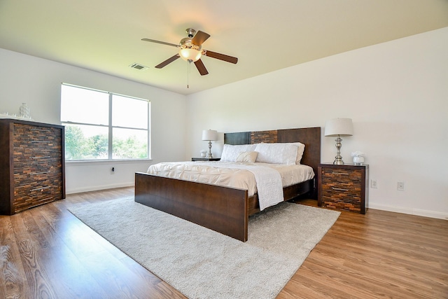 20019 Laramie River Trl, Katy, TX 77449 - bedroom featuring wood finished floors, baseboards, and a ceiling fan