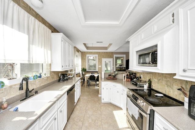 23227 Diamond Knoll Ct, Katy, TX 77494 - kitchen with stainless steel appliances, white cabinets, and light tile patterned flooring