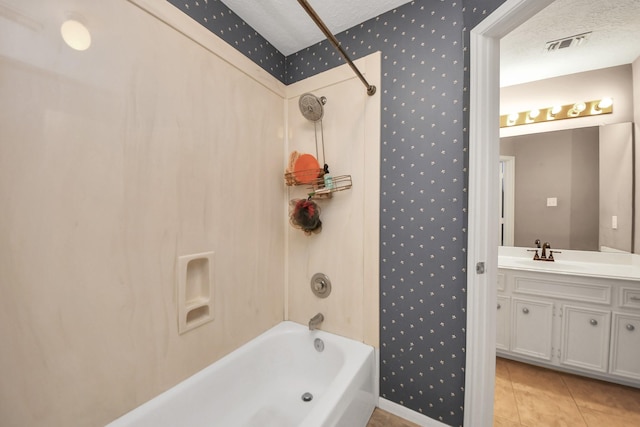 23227 Diamond Knoll Ct, Katy, TX 77494 - bathroom with tub / shower combination, vanity, wallpapered walls, tile patterned floors, and a textured ceiling