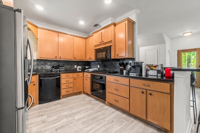 4313 Windswept Dr, Montgomery, TX 77356 - kitchen featuring black appliances, dark countertops, decorative backsplash, crown molding, and recessed lighting