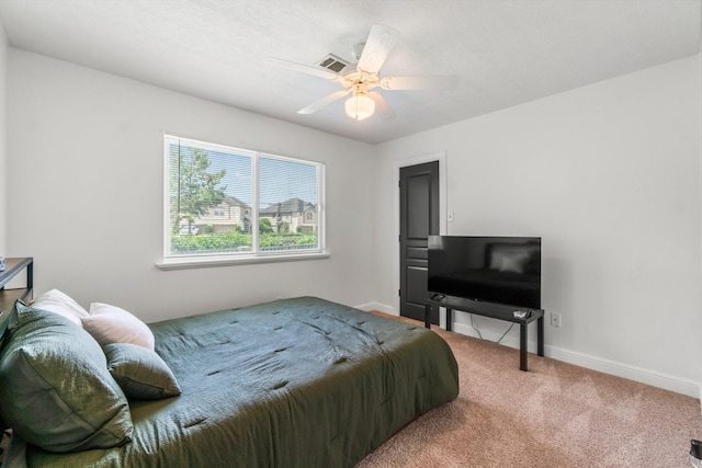 4313 Windswept Dr, Montgomery, TX 77356 - carpeted bedroom with baseboards and a ceiling fan