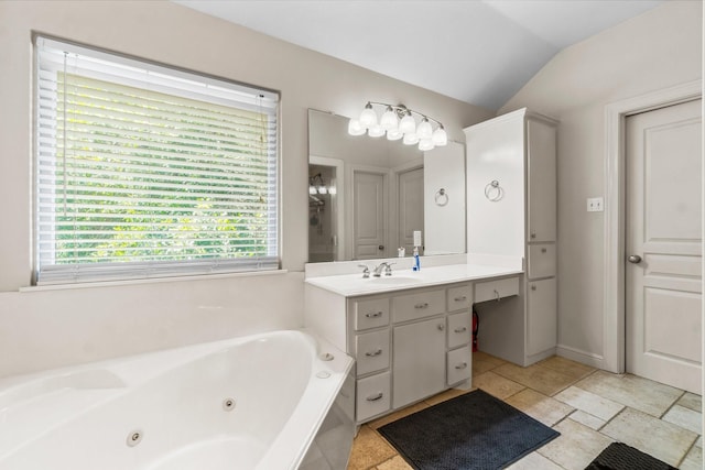 4313 Windswept Dr, Montgomery, TX 77356 - bathroom featuring vanity, a jetted tub, and vaulted ceiling