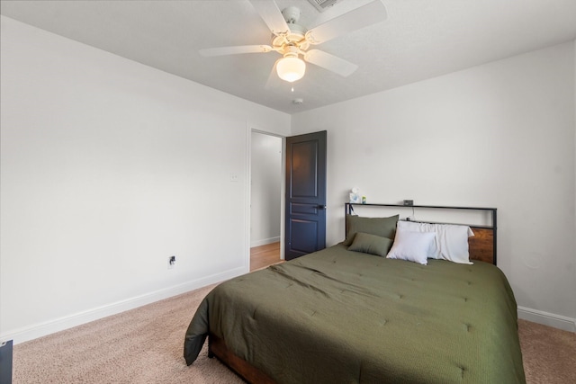 4313 Windswept Dr, Montgomery, TX 77356 - carpeted bedroom featuring baseboards and a ceiling fan