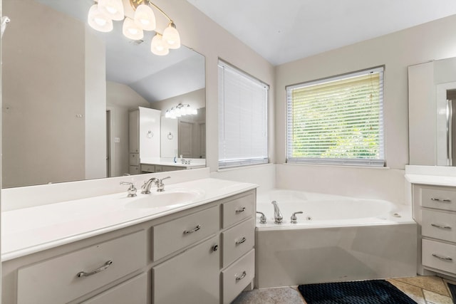4313 Windswept Dr, Montgomery, TX 77356 - full bathroom with vanity, a garden tub, a chandelier, and lofted ceiling
